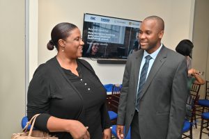 Marvin Barrette (right), Account Executive, Phoenix International, converses with Nikisha Walters, CEO, WILCO Finance, at the recent Financial Inclusion webinar hosted by Phoenix International in Kingston, Jamaica